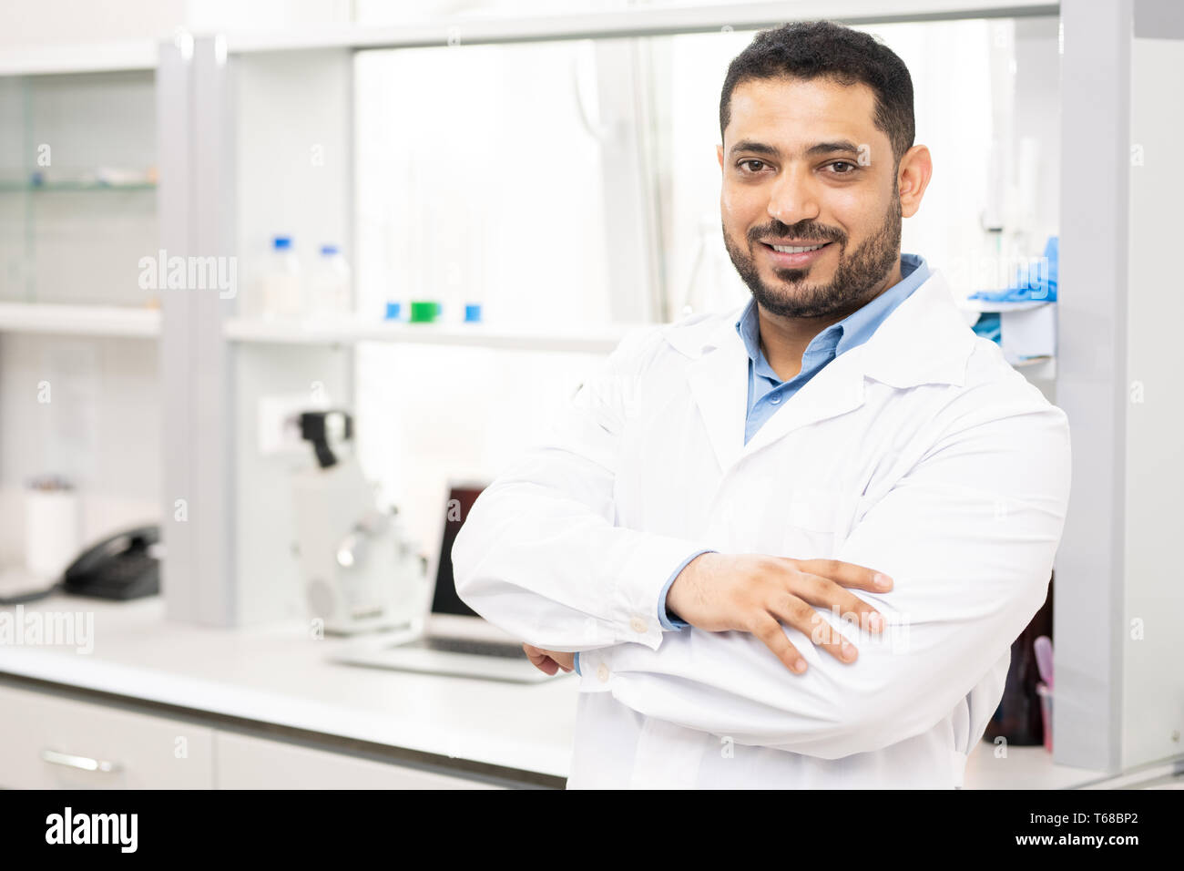 Smiling lab worker in white coat Stock Photo