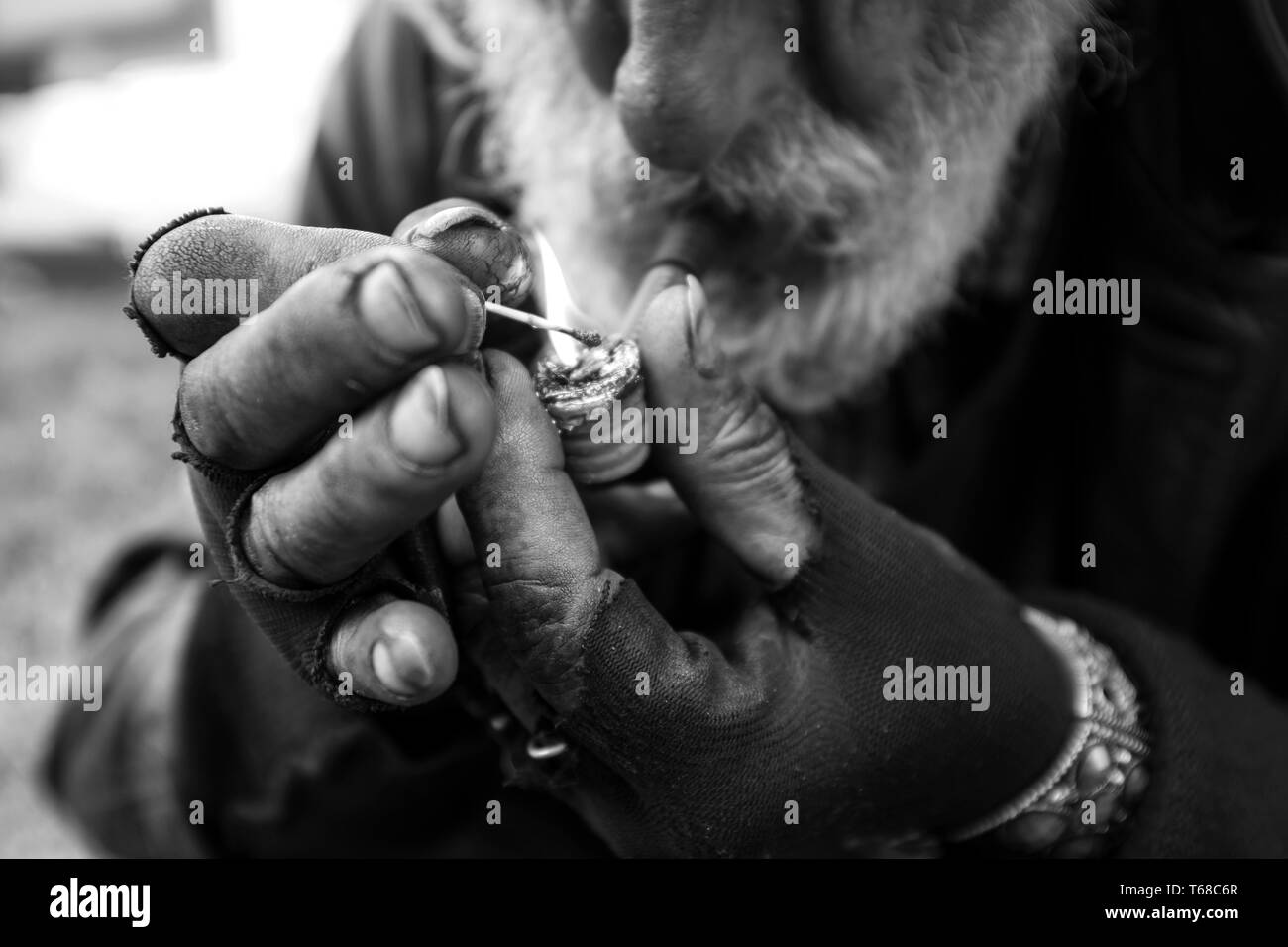 Elderly man smoking basuco, Bogota, Colombia Stock Photo