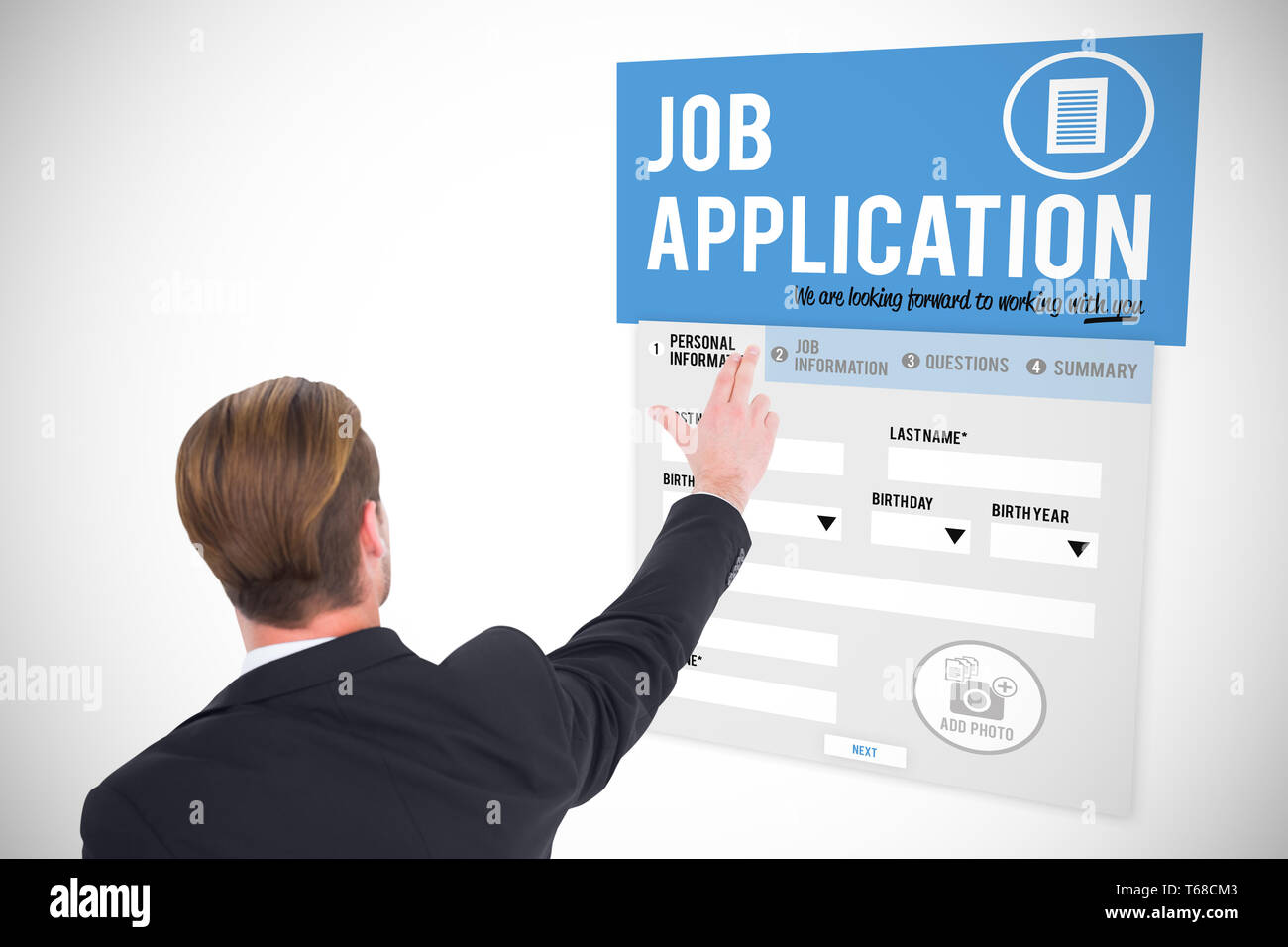 Composite image of rear view of businessman pointing with his fingers Stock Photo