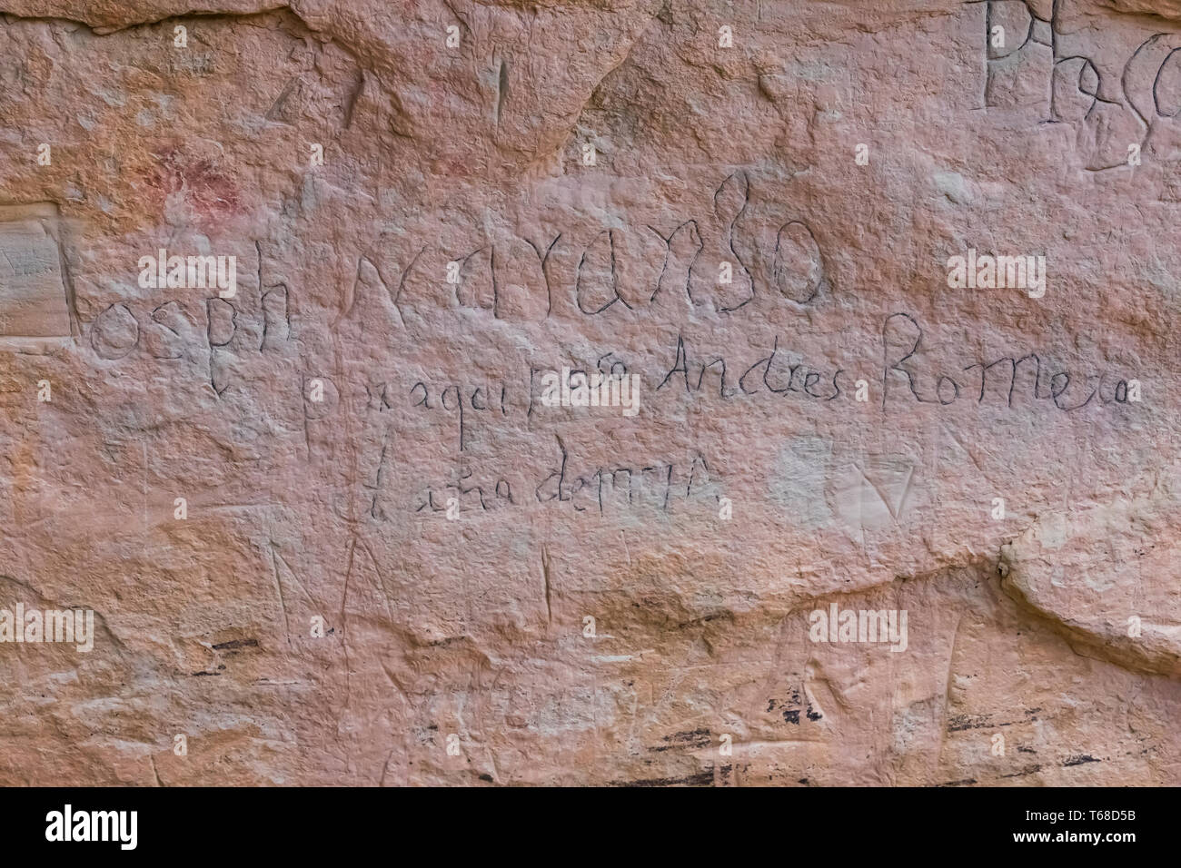 Spanish inscription from centuries ago, perhaps enhanced by an early NPS attempt at preservation, viewed along the Inscription Rock Trail in El Morro  Stock Photo