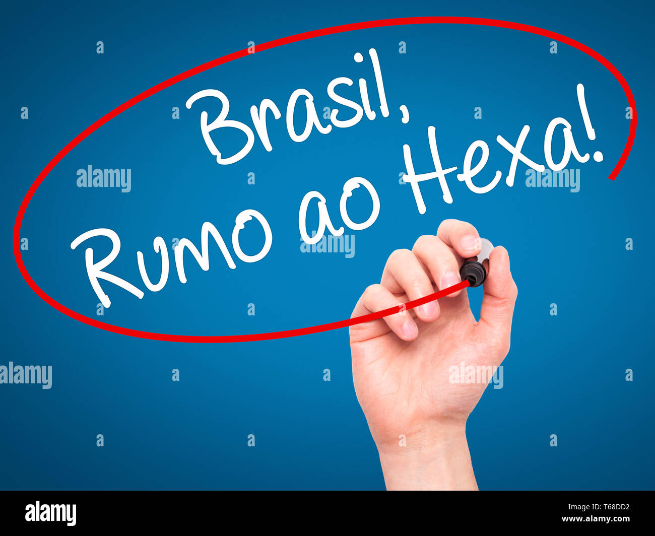 Man Hand writing Brasil, Rumo ao Hexa! with black marker on visual screen. Stock Photo