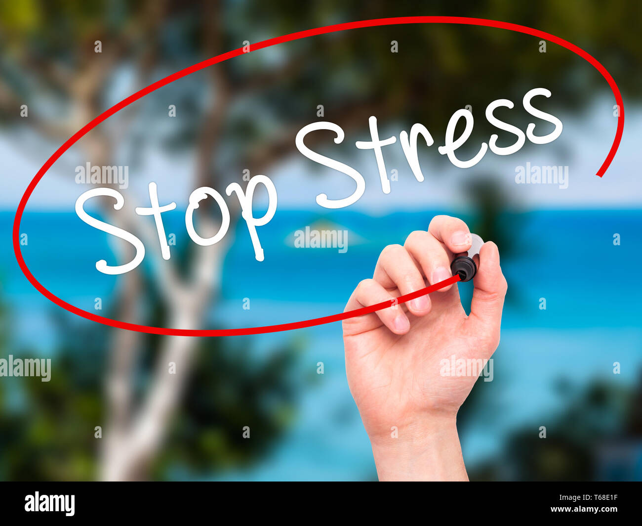 Man Hand writing Stop Stress with black marker on visual screen Stock Photo