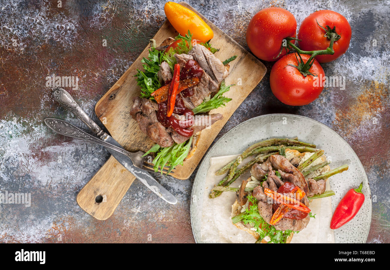 Top view Grilled sandwich with turkey meat, fried asparagus, mushrooms