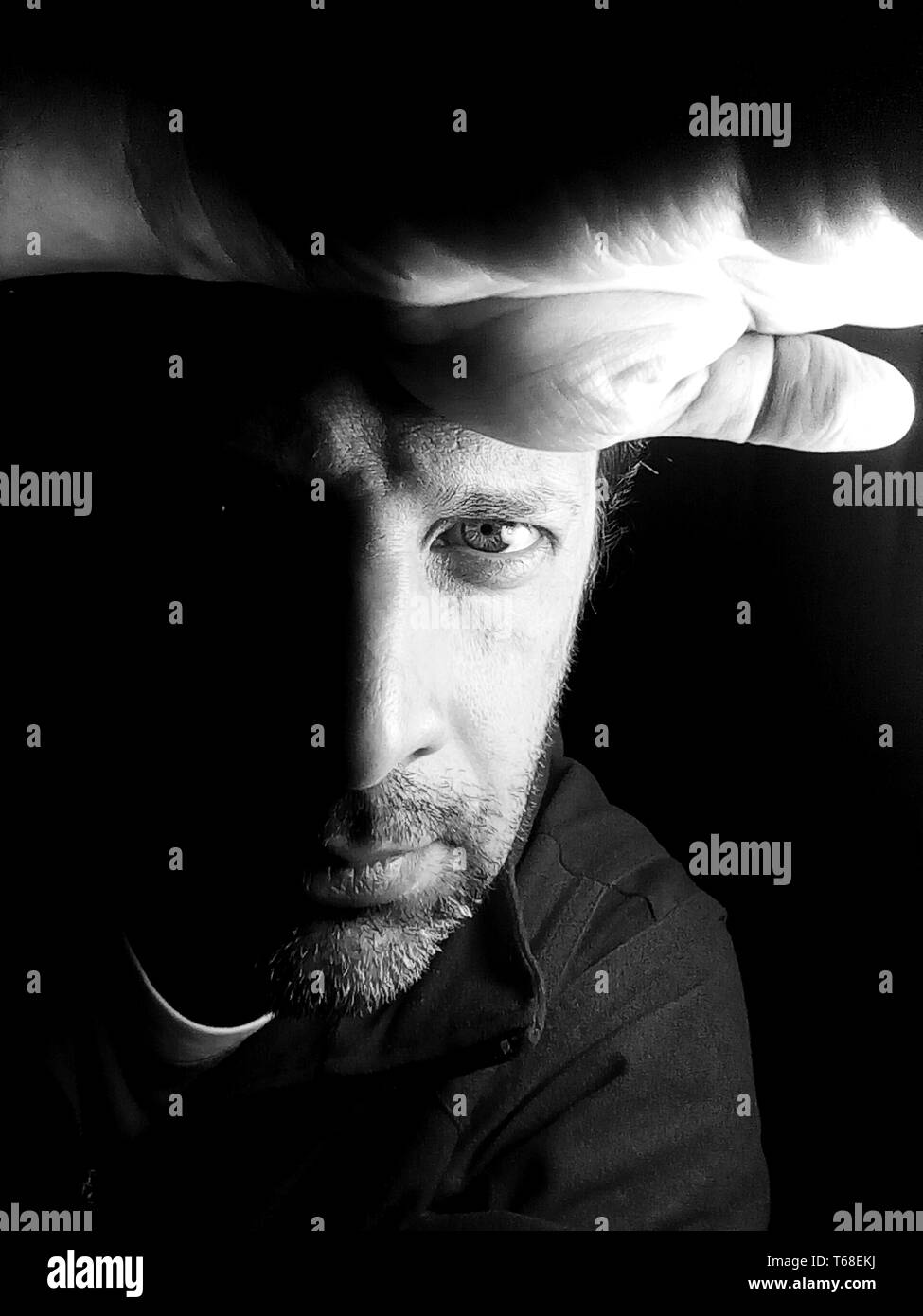 Man face in light black and white Black and White Stock Photos & Images ...