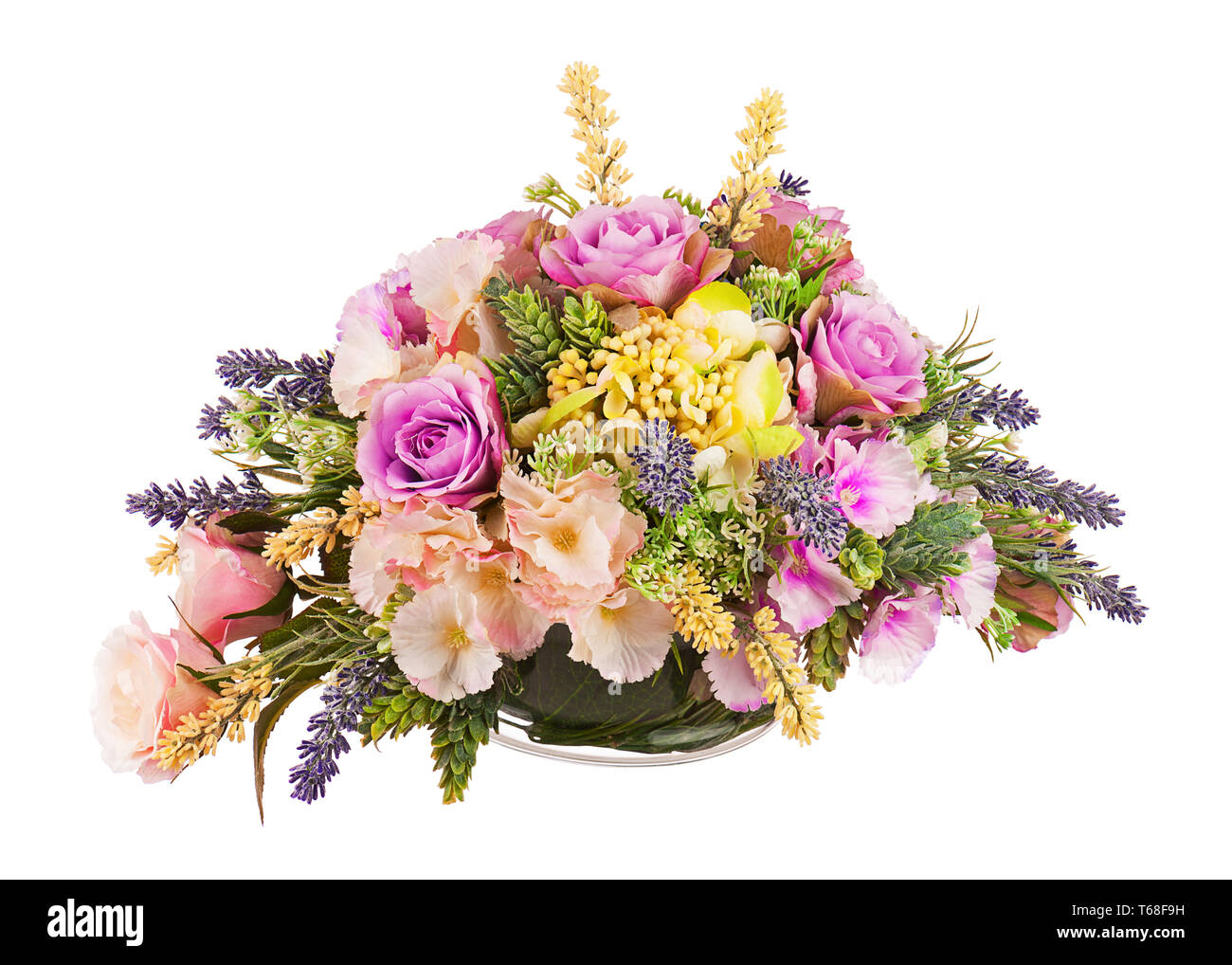 Bouquet from artificial flowers arrangement centerpiece in vase. Stock Photo