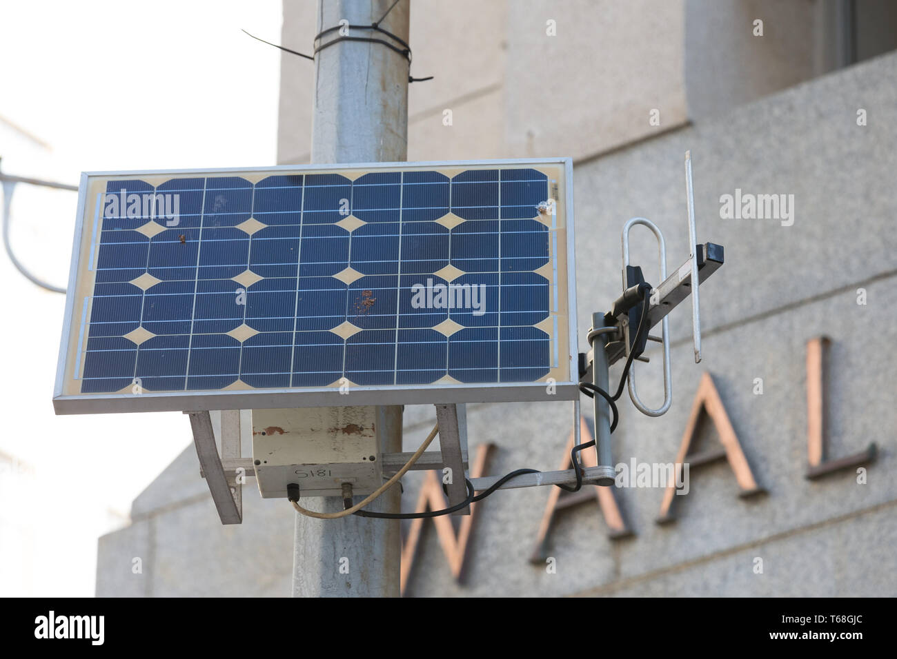 photovoltaic solar energy panel on a lamp post or pole in the city