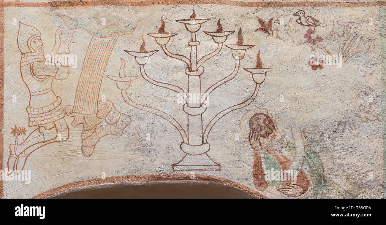 A seven-branched candelabrum, the Menorah, is the national symbol of Israel, a 500 years old gotic mural in Tirsted church, Denmark, April 17, 2019 Stock Photo