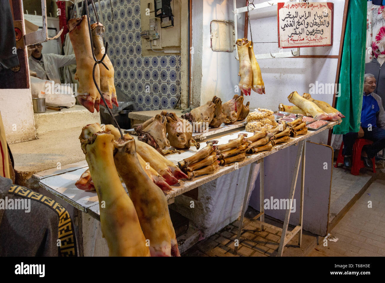 Medina of Rabat, Rabat, Morocco, April 24 2019. A market stall in the local souk selling fresh produce of cows legs and trotters and goats heads. Stock Photo
