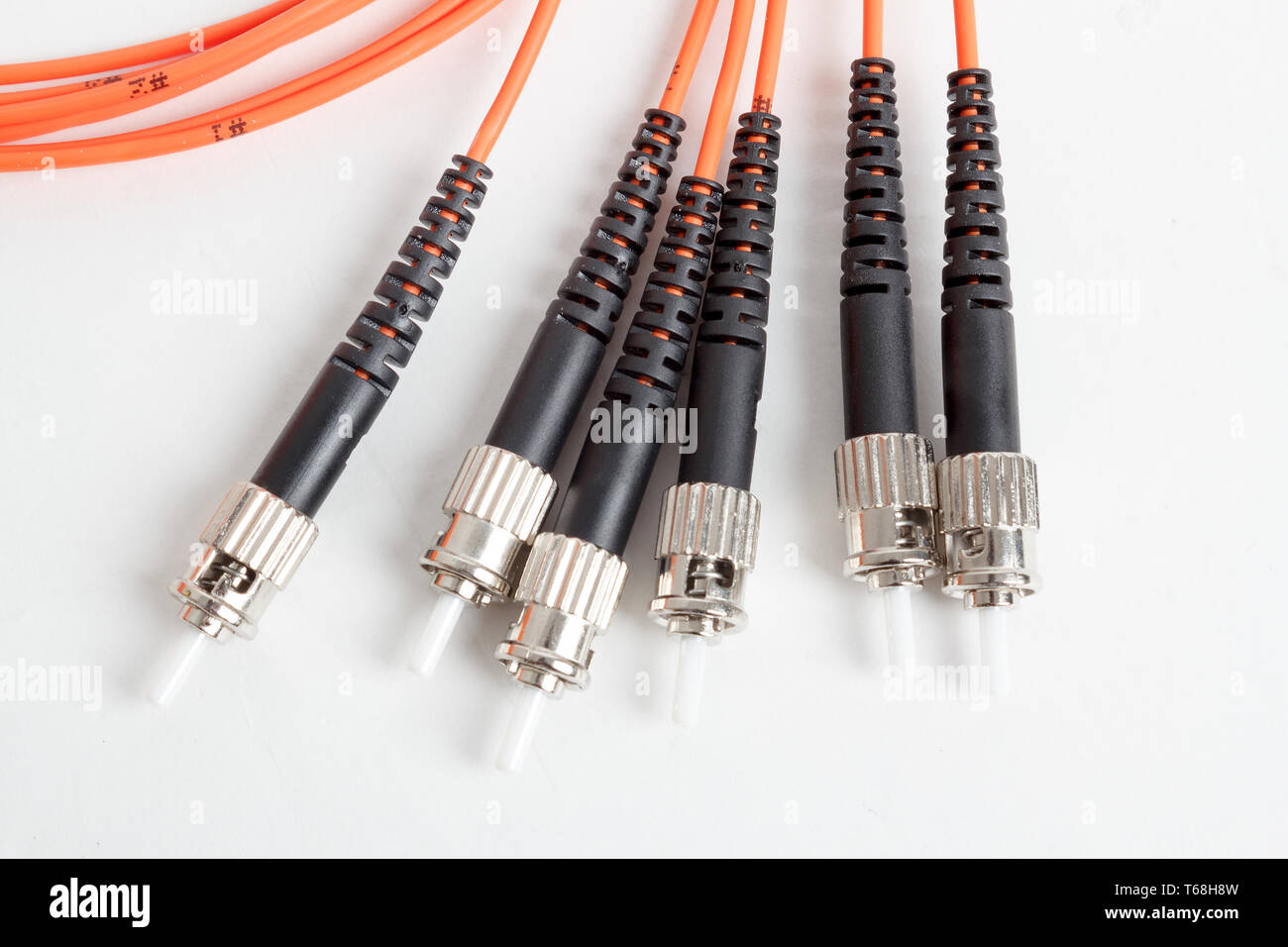orange fiber optic ST connector patchcord Stock Photo Alamy
