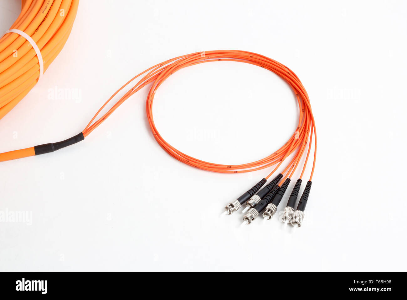 orange fiber optic ST connector patchcord Stock Photo Alamy