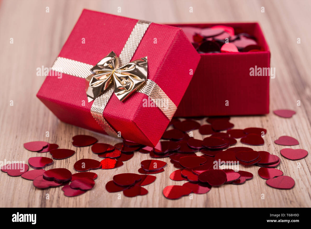 Red hearts confetti in box valentine love concept Stock Photo Alamy