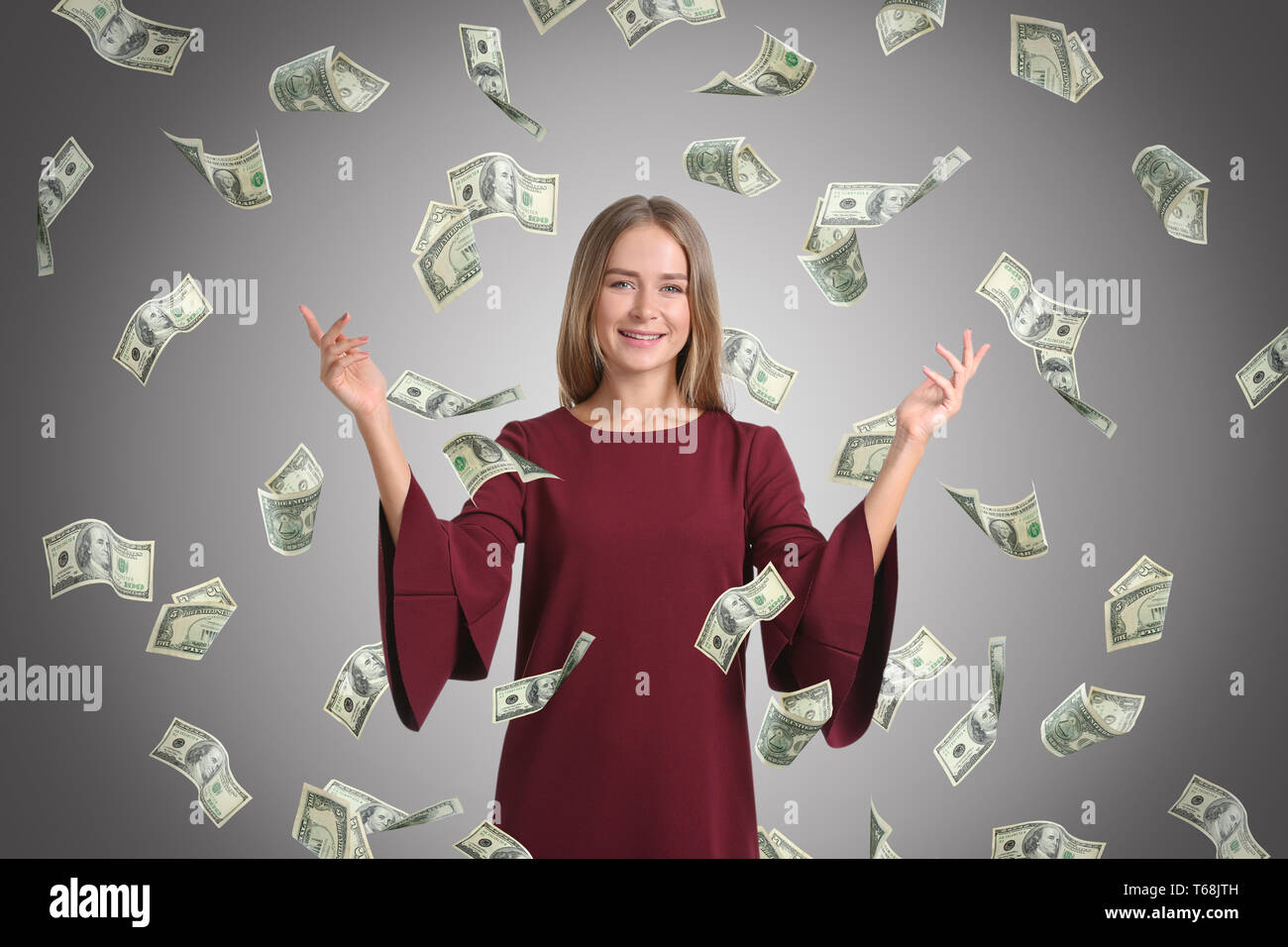 Happy Rich Woman With Falling Dollar Banknotes On White Background