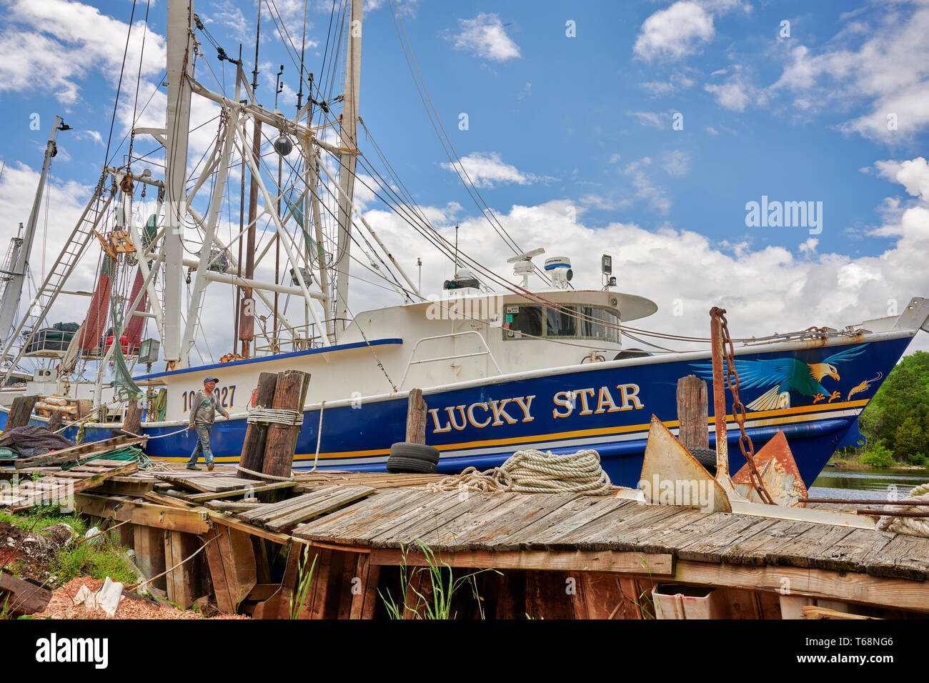 Commercial fishing boats and shrimp boats, Lucky Star, part of the fishing fleet, tied up  in Bayou La Batre Alabama, USA. Stock Photo