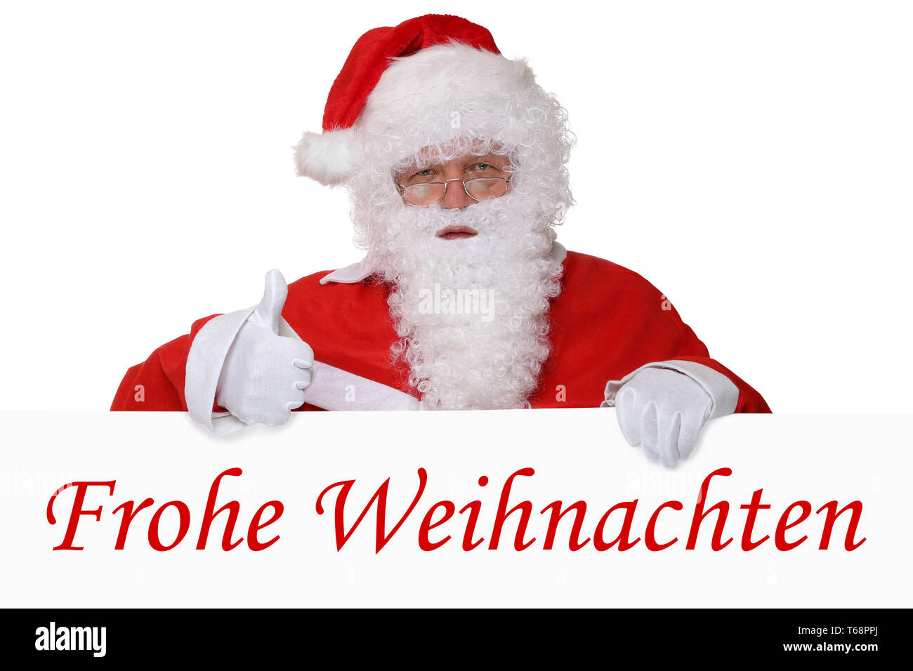 Weihnachtsmann Nikolaus zeigt Frohe Weihnachten Weihnachtskarte Daumen hoch Stock Photo