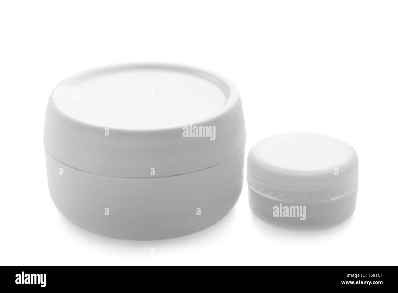 Jars with skin care cosmetics on white background Stock Photo Alamy