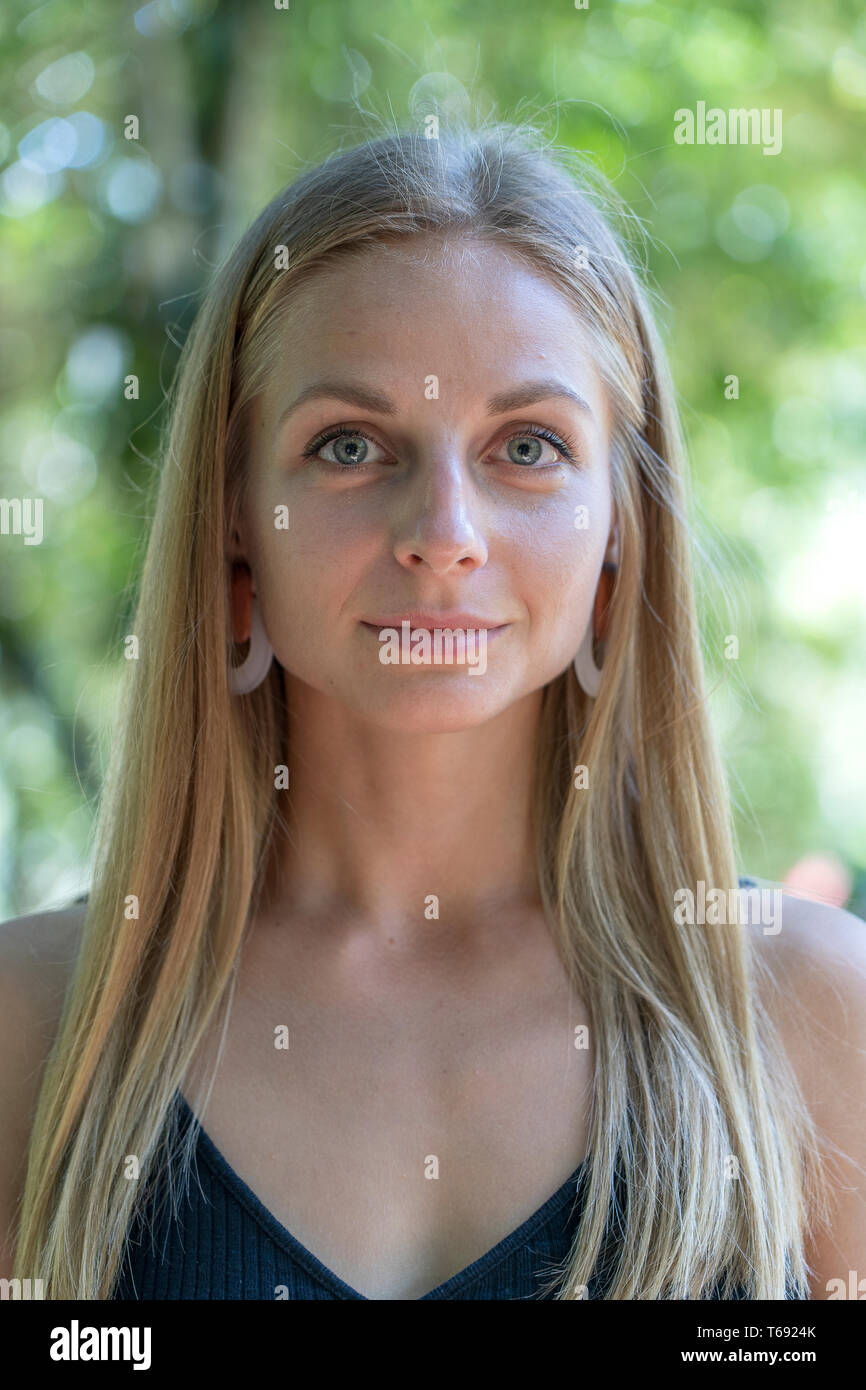 Beautiful Caucasian Blonde Girl In Nature Background A Portrait Of A Young Woman In Tropical