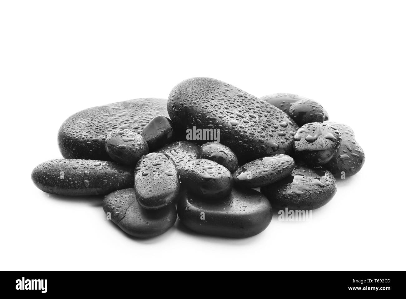 Spa stones with drops of water on white background Stock Photo - Alamy