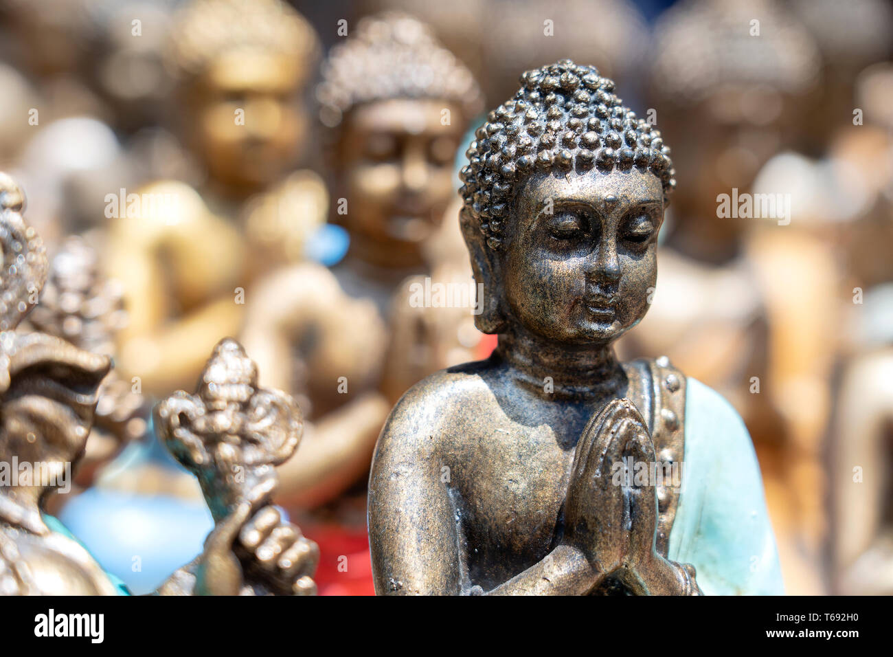 Buddha statue figures souvenir on display for sale on street market in