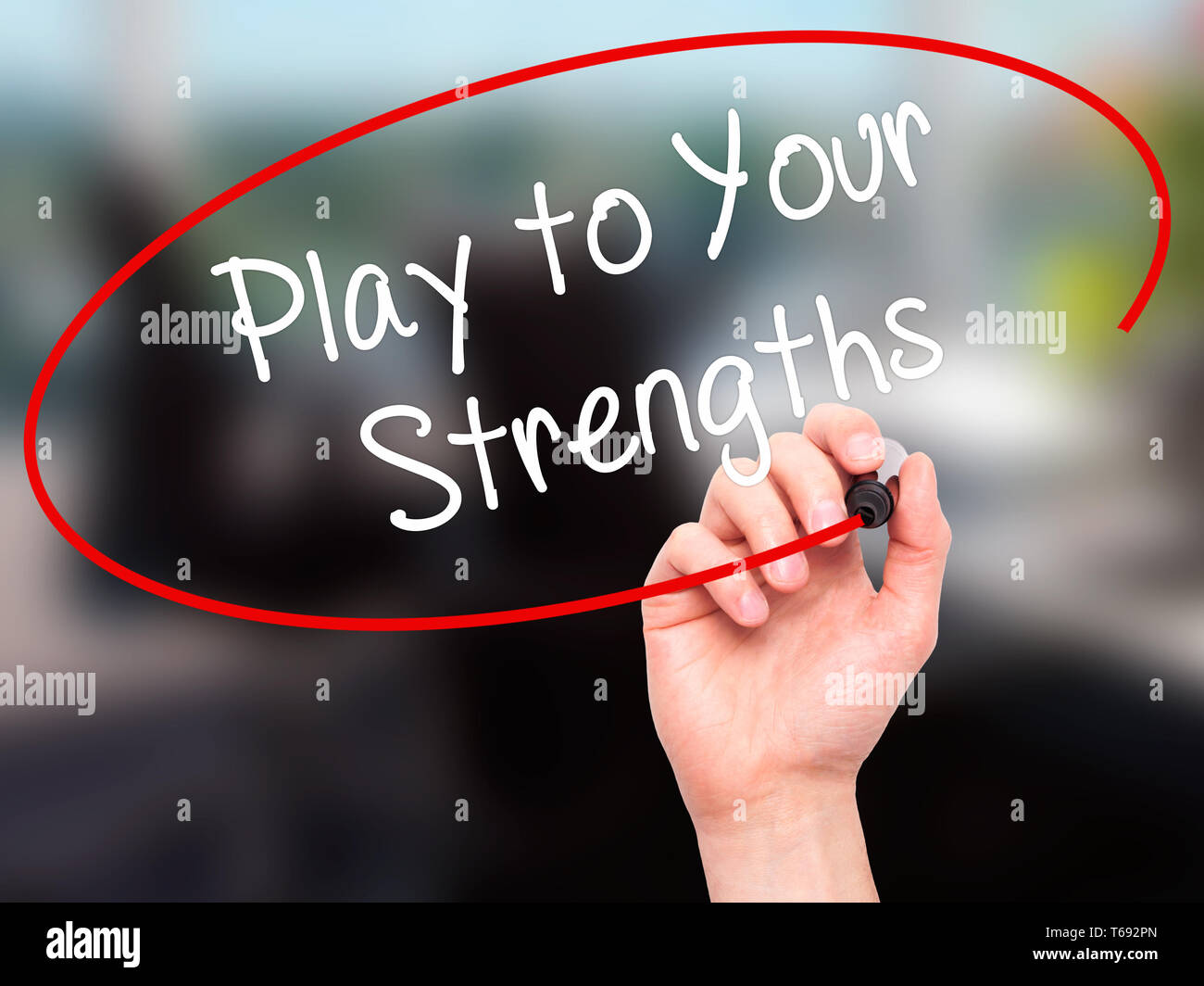 Man Hand writing Play to Your Strengths with black marker on visual ...