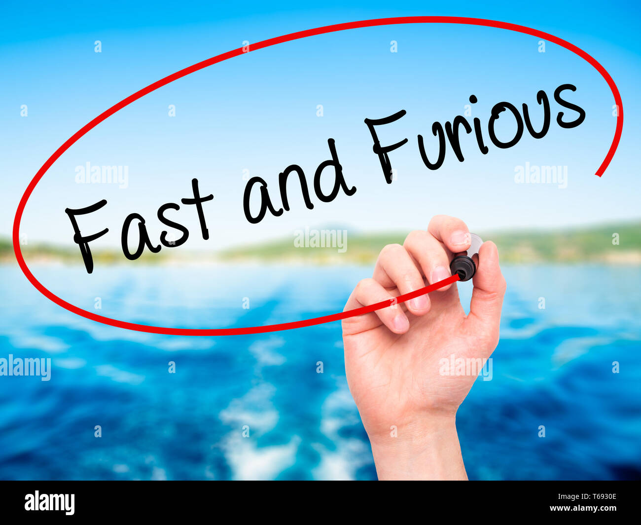 Writing Too Fast Visual Man Hand writing Fast and Furious with black marker on visual screen ...