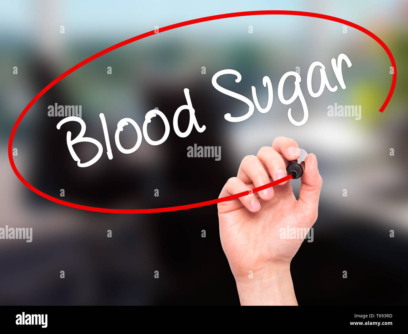 Man Hand writing Blood Sugar with black marker on visual screen