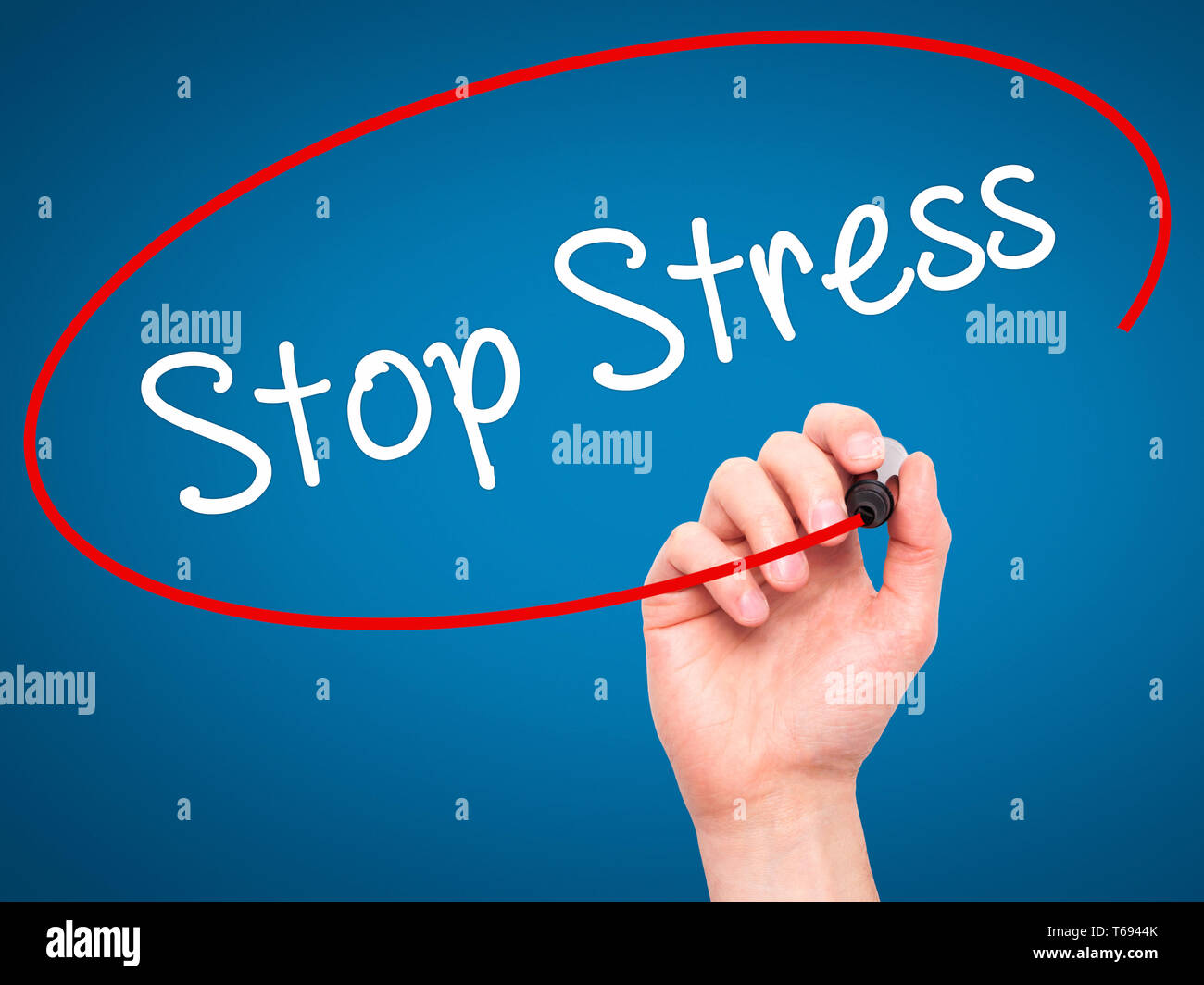 Man Hand writing Stop Stress with black marker on visual screen Stock Photo
