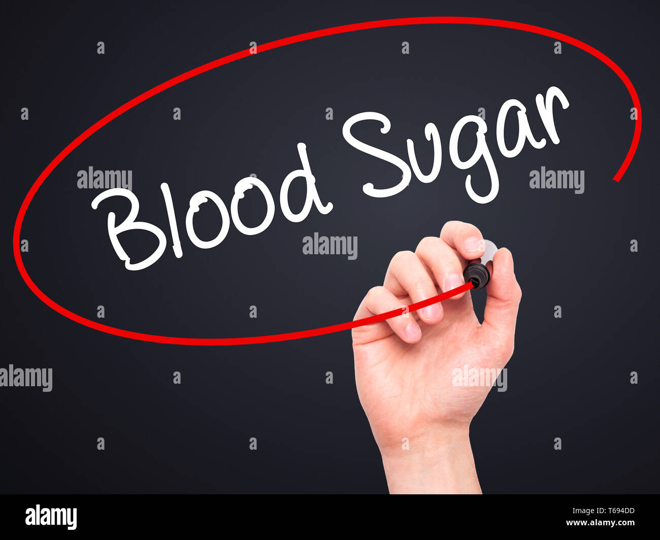 Man Hand writing Blood Sugar with black marker on visual screen