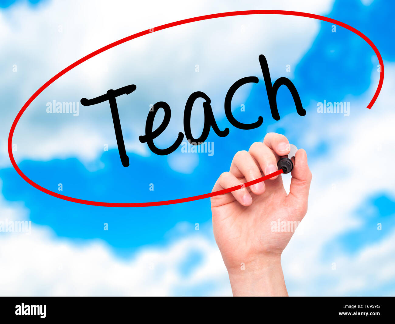 Man Hand writing Teach with black marker on visual screen Stock Photo ...