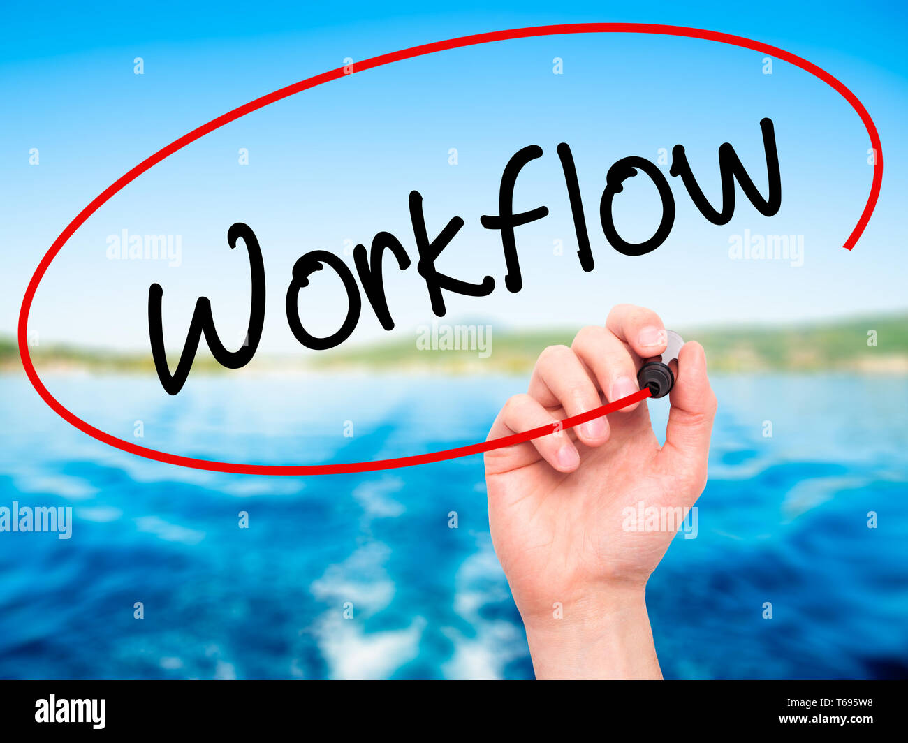 Man Hand writing Workflow  with black marker on visual screen. Stock Photo