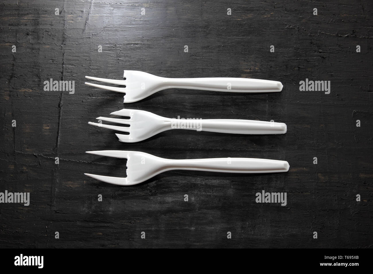 Plastic Forks on Wooden Background Stock Photo