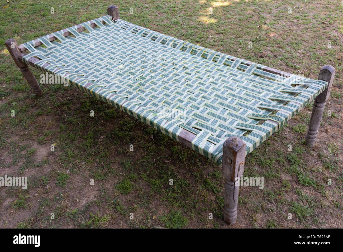 https://c8.alamy.com/comp/T696AF/traditional-homemade-wooden-plastic-rope-bed-lying-in-outside-T696AF.jpg