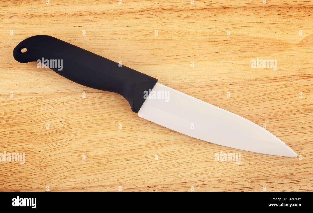 Ceramic Knife On Cutting Board Stock Photo Alamy
