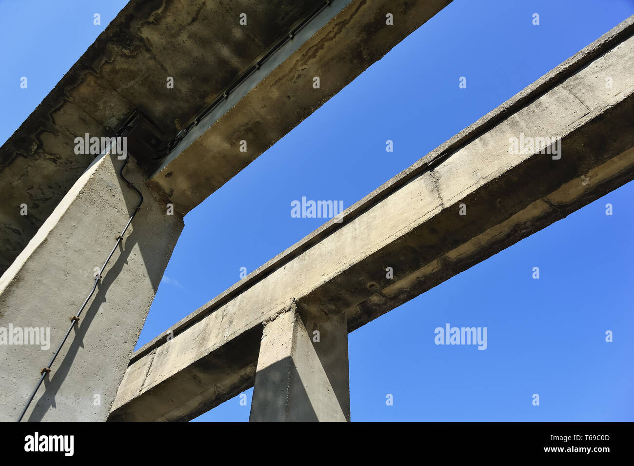 Two bridges rather dilapidated parts made of concrete Stock Photo