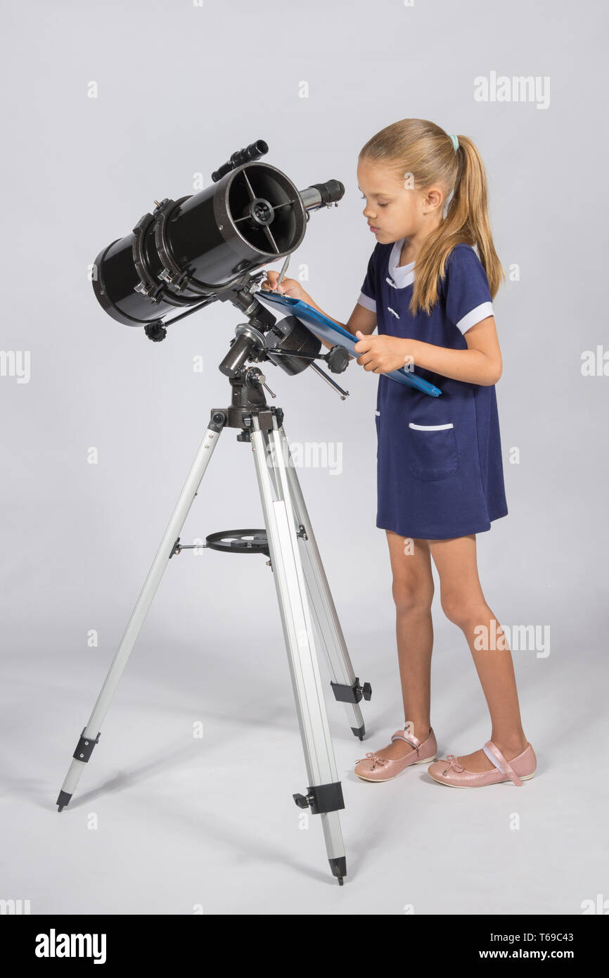 The astronomer carefully recorded observations on a sheet of paper Stock Photo
