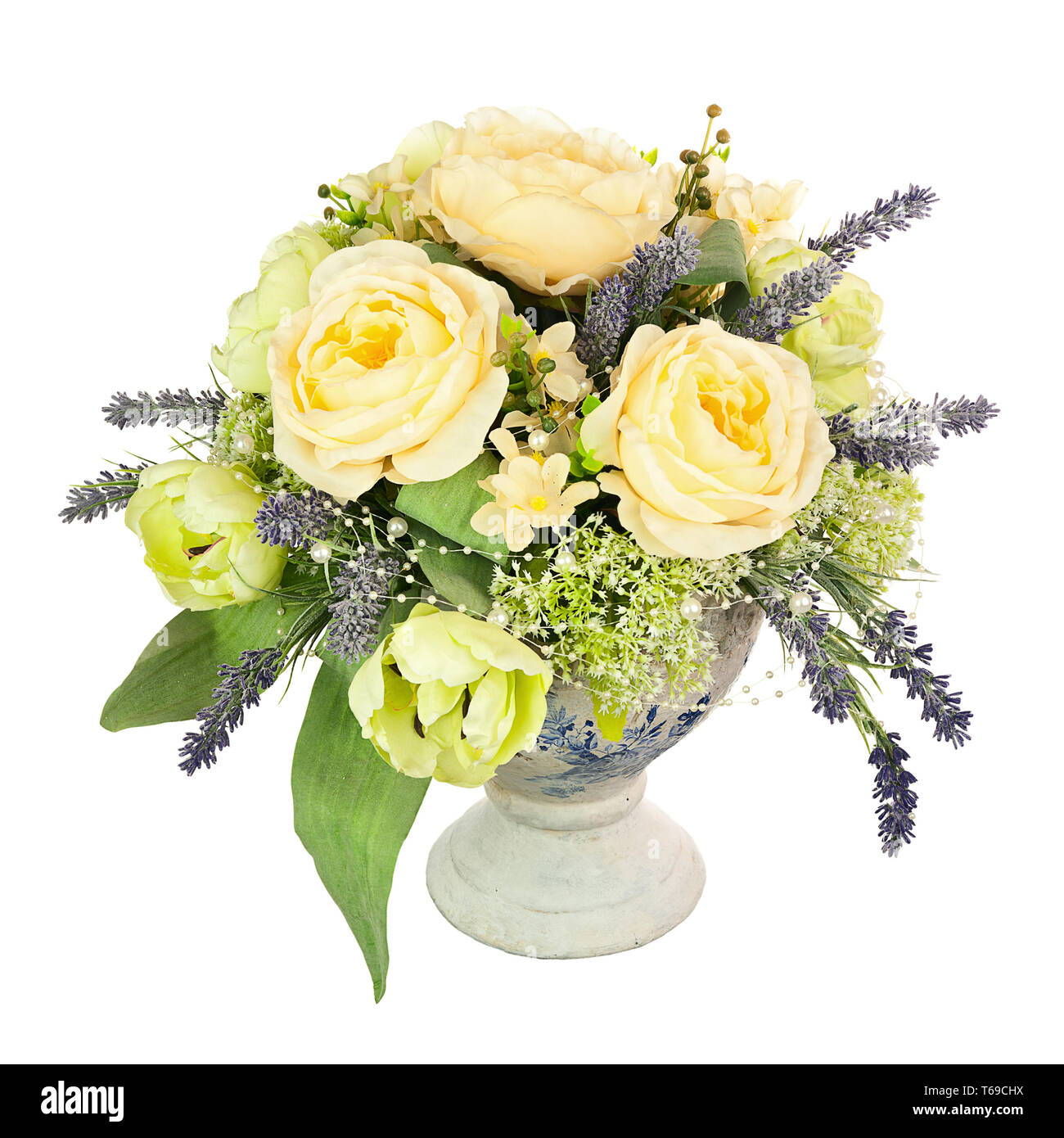 Bouquet from artificial flowers arrangement centerpiece in old vase. Stock Photo