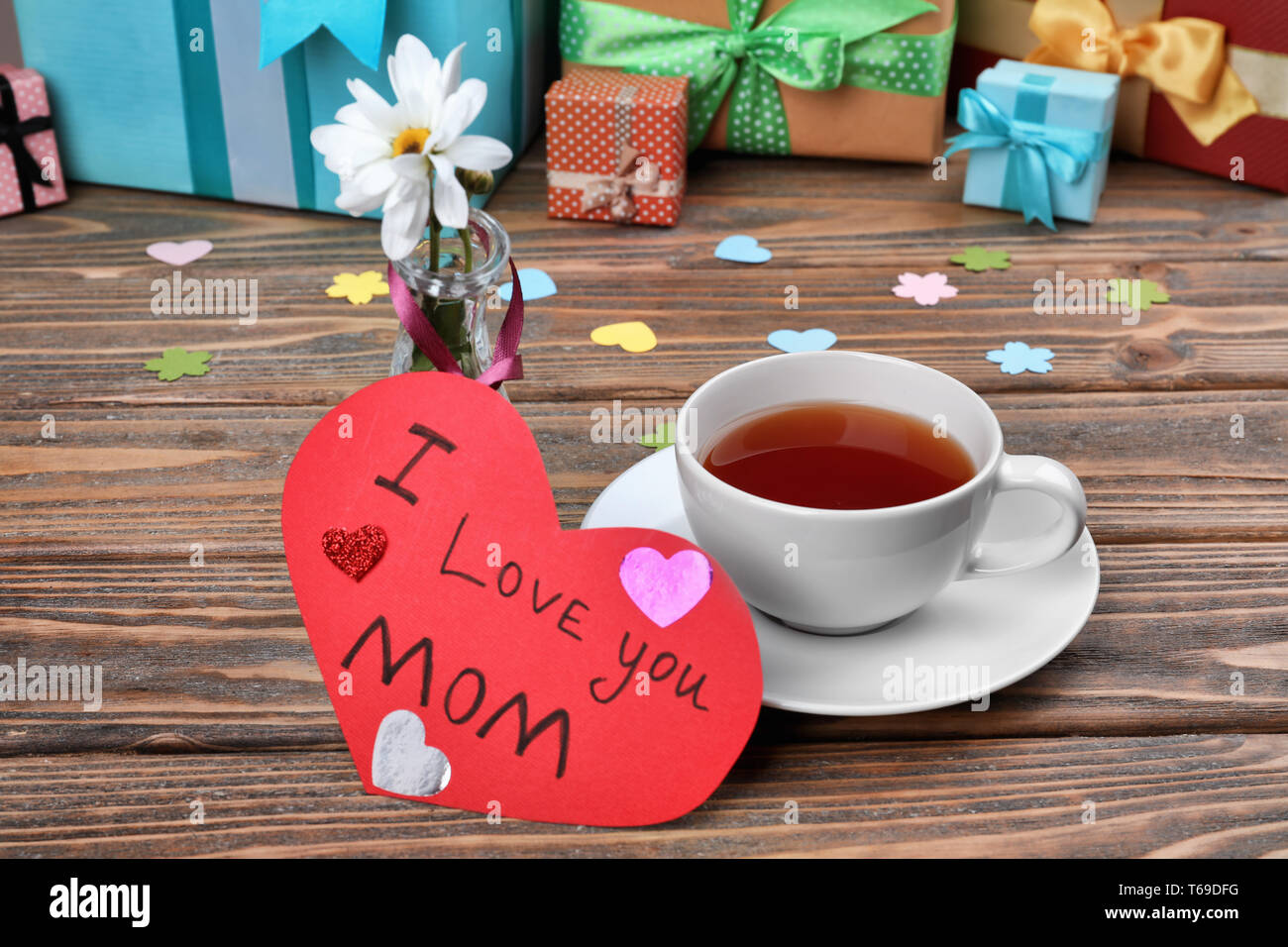 Cup of tea and card with words I love you Mom on table. Mother's Day  celebration Stock Photo - Alamy