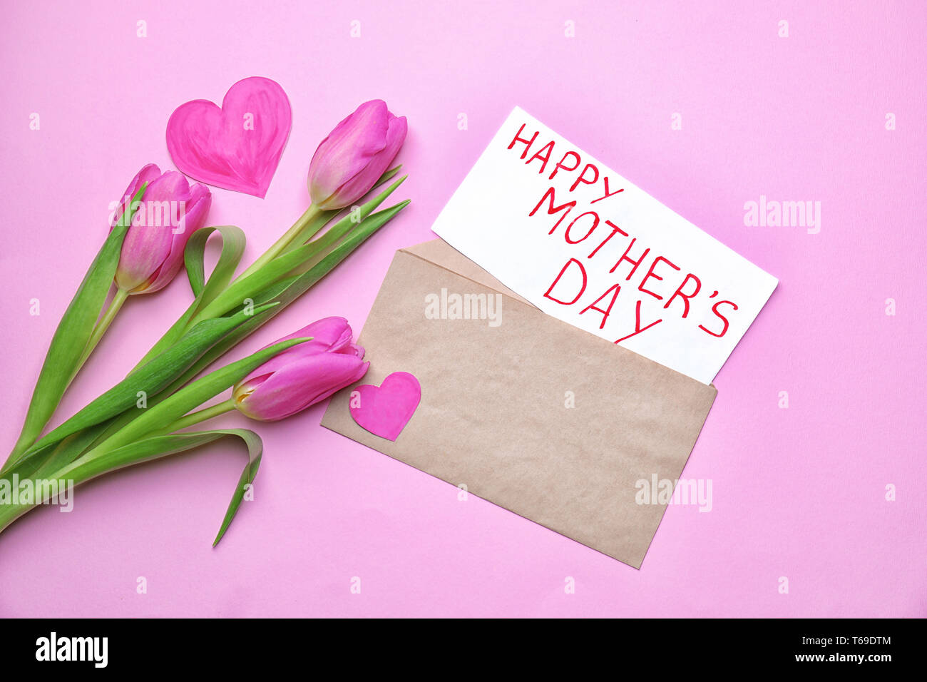 Beautiful tulips and card with text HAPPY MOTHER'S DAY on color ...