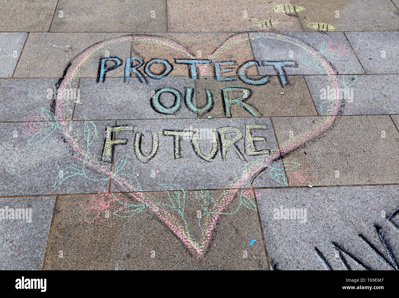 Chalk graffiti in the Town Square in Weston-super-Mare, UK as part of a protest organised by Extinction Rebellion Weston-super-Mare. Stock Photo