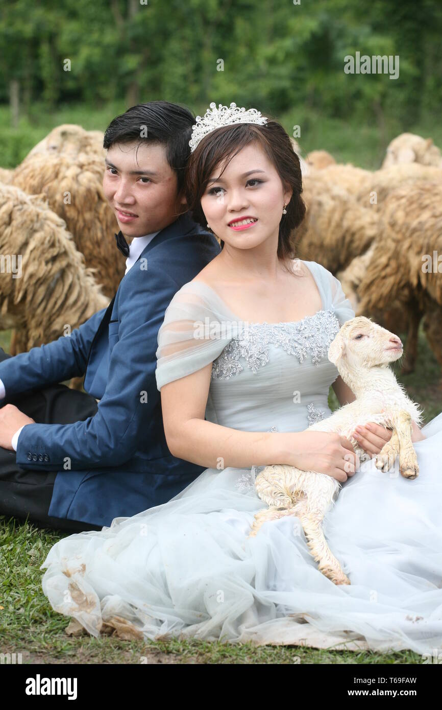 Portrait of the bride and groom leaning on each other Stock Photo - Alamy