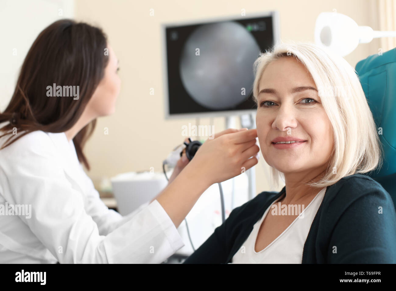 Mature woman in otolaryngologist's office Stock Photo Alamy