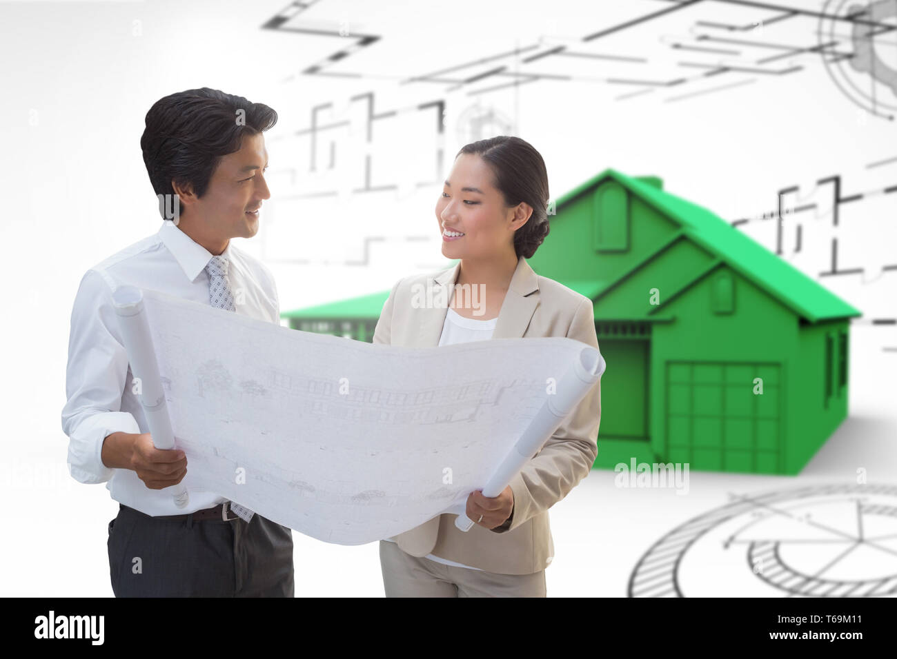 Composite image of estate agent looking at blueprint with potential buyer Stock Photo
