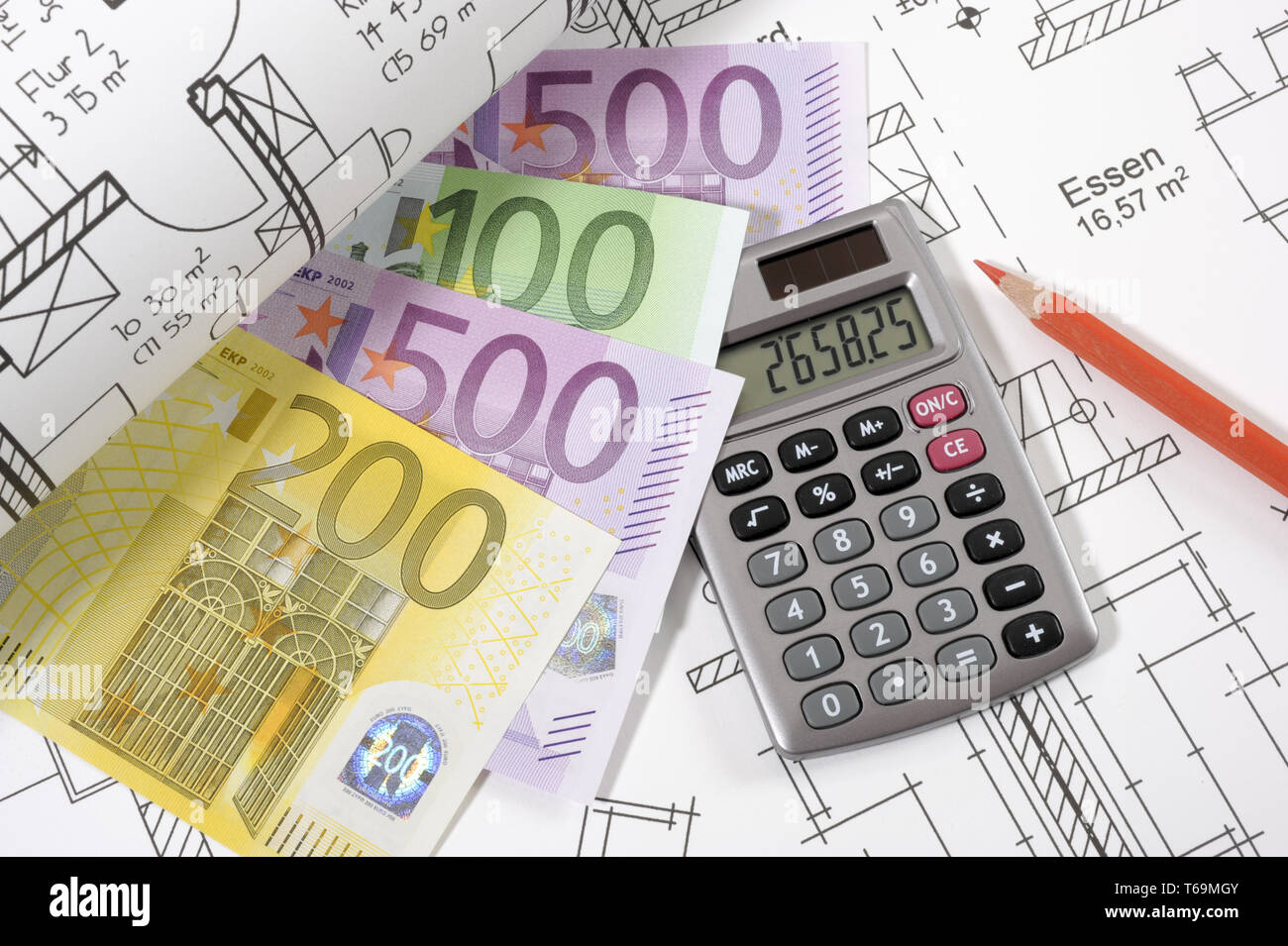 house construction with plan, euro and calculator Stock Photo