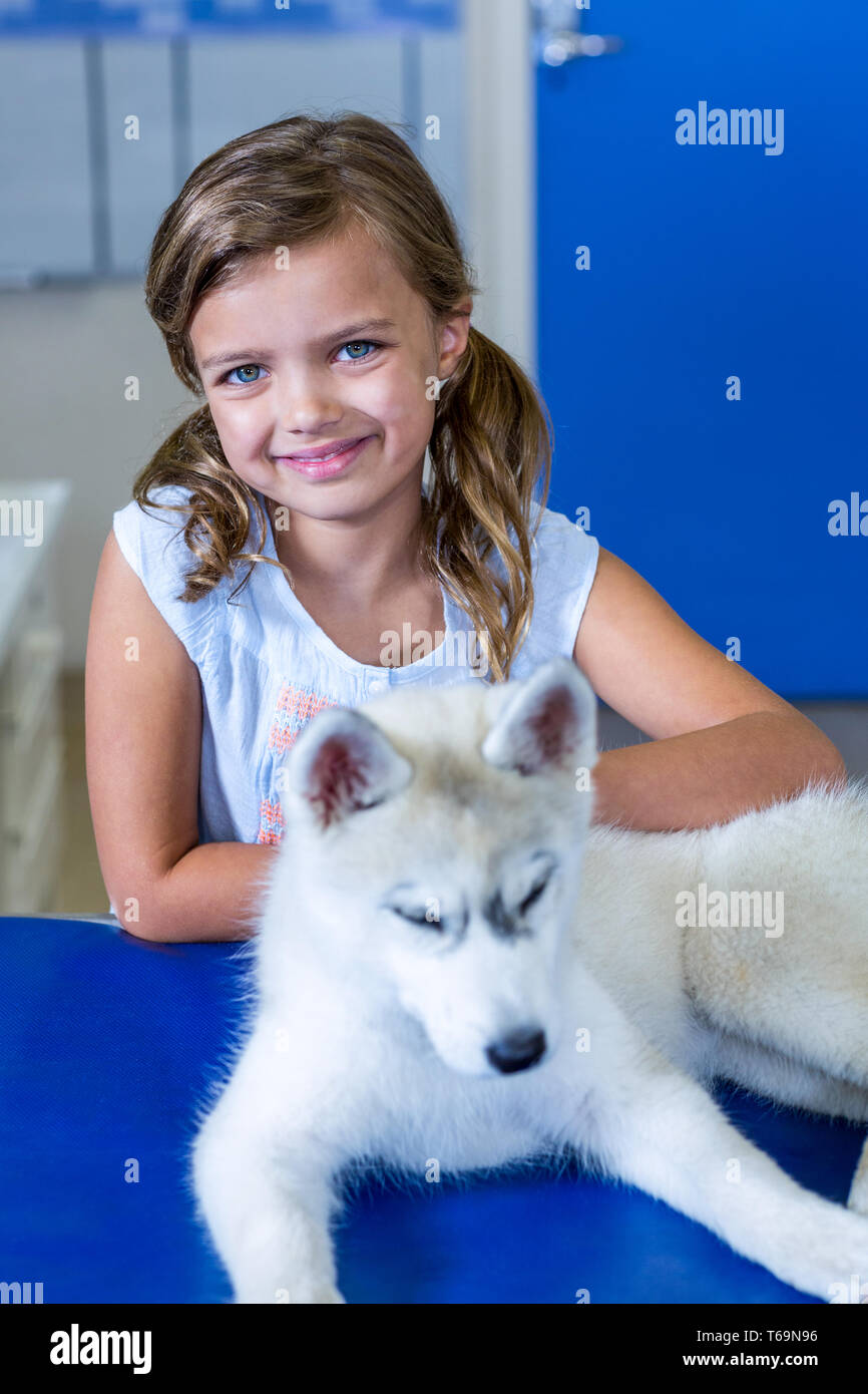 Portrait of little girl smiling and posing with a cute puppy Stock ...
