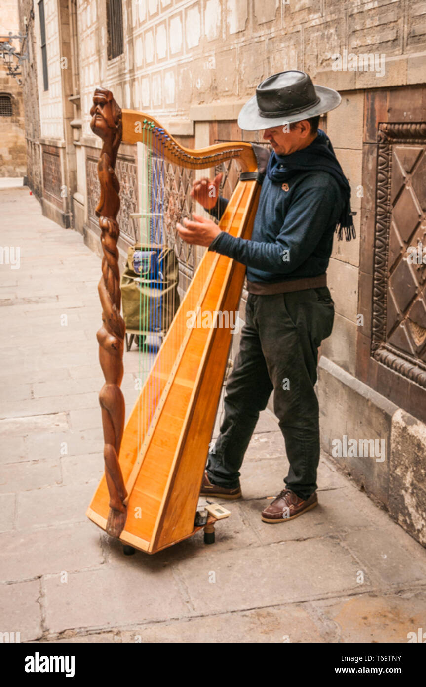 Harpist playing for Tourists in Barcelona, Spain Stock Photo