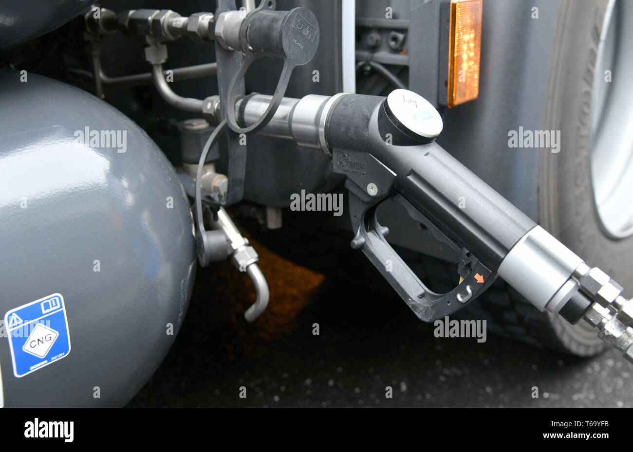 Berlin, Germany. 29th Apr, 2019. A fuel nozzle is located on the BEHALA port premises in Berlin in the tank of a semi-trailer tractor powered by biomethane. According to the Ministry of Transport, CO2 emissions will be reduced by up to 94 percent compared to transports with diesel-powered trucks. Credit: Bernd Settnik/dpa-Zentralbild/ZB/dpa/Alamy Live News Stock Photo