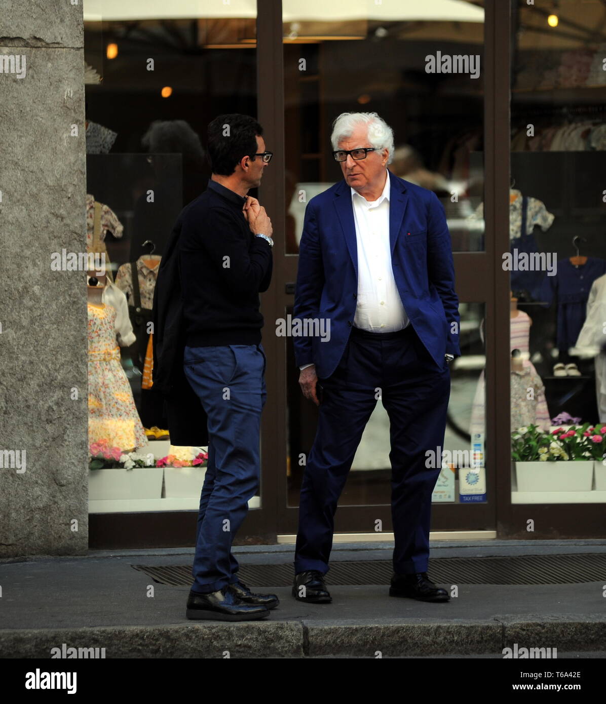 Milan, Patrizio Bertelli in the center Patrizio Bertelli, the patron of the  "Prada" brand together with his wife Miuccia, surprised at the exit of the  restaurant while talking to a friend, then