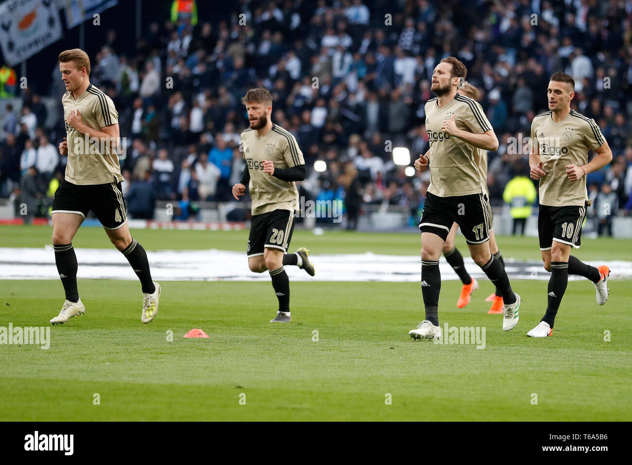 LONDON Football, 30-04-2019, season 2018 / 2019 , Tottenham Stadium . Semi final Champions League first leg. Ajax player Matthijs de Ligt, Ajax player Lasse Schone, Ajax player Daley Blind and Ajax player Dusan Tadic during the warming up during the game Tottenham Hotspur - Ajax Stock Photo