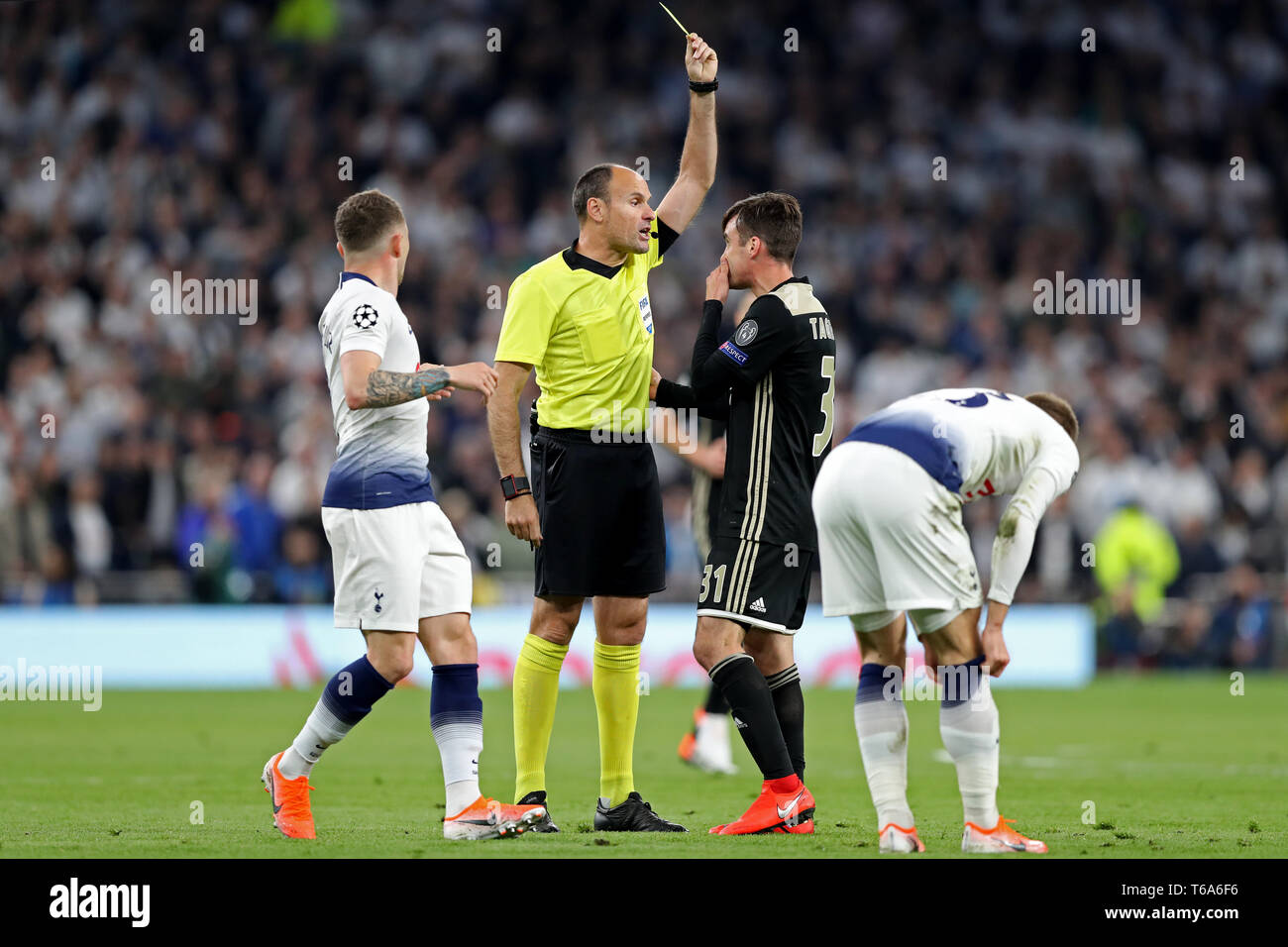 London, UK. 30th Apr 2019. Ajax defender Nicolas Tagliafico is shown the yellow card by Referee Antonio Mateu Lahoz during the UEFA Champions League match between Tottenham Hotspur and Ajax Amsterdam at White Hart Lane, London on Tuesday 30th April 2019. (Credit: Jon Bromley | MI News) Credit: MI News & Sport /Alamy Live News Stock Photo