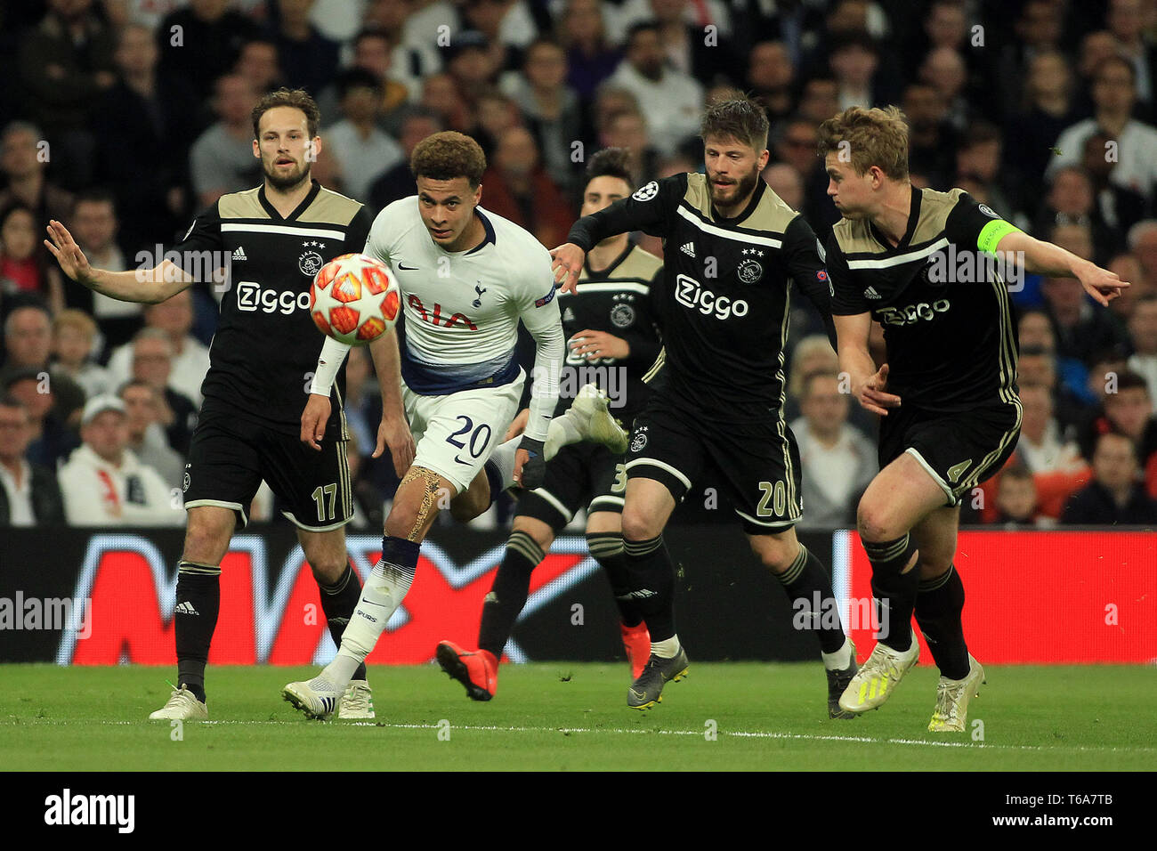 London, UK. 30th Apr, 2019. Dele Alli of Tottenham Hotspur (2L) takes on Daley Blind (1L), Lasse Schone (1R) and Matthijs de Light of Ajax (2R). UEFA Champions league match, semi- final, 1st leg match , Tottenham Hotspur v Ajax at The Tottenham Hotspur Stadium in London on Tuesday 30th April 2019.  this image may only be used for Editorial purposes. Editorial use only, license required for commercial use. No use in betting, games or a single club/league/player publications . Credit: Andrew Orchard sports photography/Alamy Live News Stock Photo
