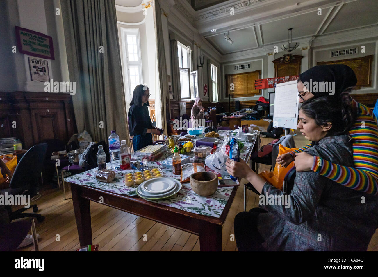 London, UK. 30th April 2018. Goldsmiths Anti-Racist Action celebrate 50 days of occupation of the management building, the former Deptford Town Hall and prepare food for a party. The occupation began when the university failed to respond adequately to racist abuse of a candidate in the student elections. Students claim the university fails to treat BAME students and workers fairly, and among other demands insist Goldsmiths produces a strategic plan to tackle racism. Credit: Peter Marshall/Alamy Live News Stock Photo